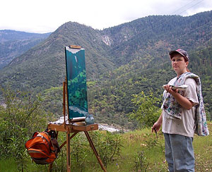 Susan painting on site above the Merced in El Portal